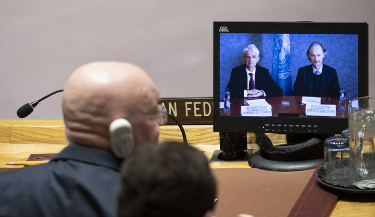 Mark Lowcock (left on screen), Under-Secretary-General for Humanitarian Affairs and Emergency Relief Coordinator, and Geir O. Pederson (right on screen), Special Envoy for Syria, brief the Security Council meeting on the situation in Syria. Listening in the foreground is Vassily Nebenzia, Permanent Representative of the Russian Federation to the United Nations.